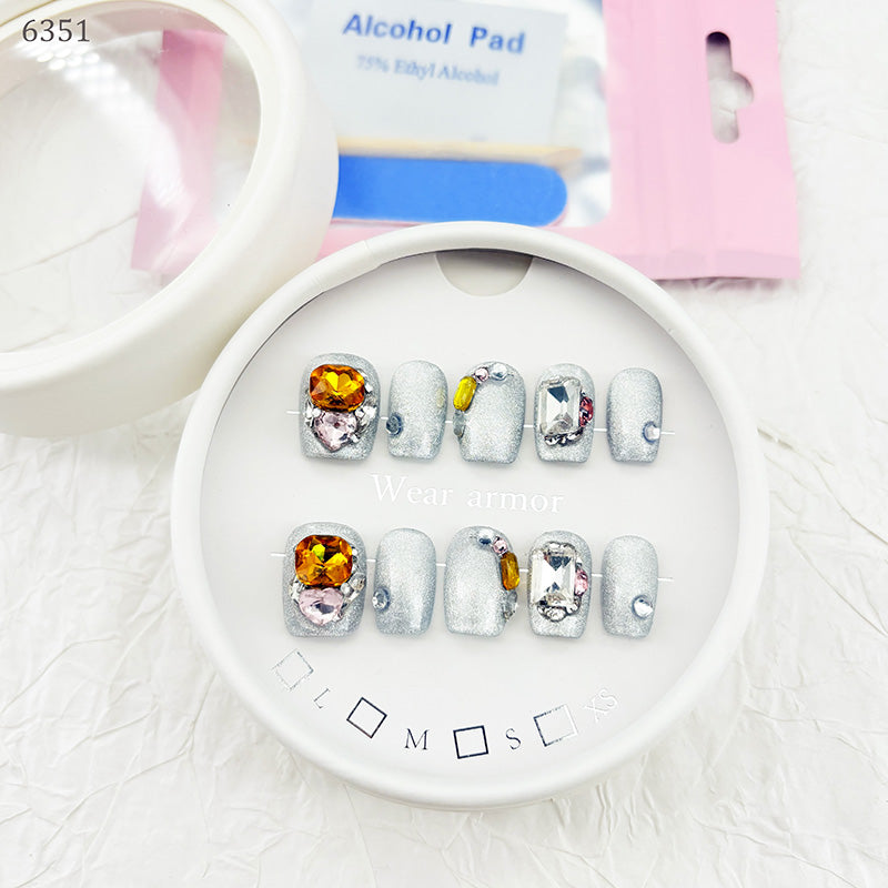 zb73..A display board featuring 24 different styles of fashionable and trendy nail wear.