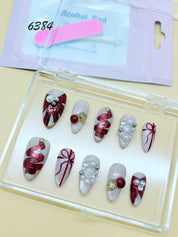 zb78..A display board featuring 24 different styles of fashionable and trendy nail wear.